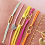 Confectionnez des bracelets hauts en couleurs avec du cordon en satin et des connecteurs en acier inox 